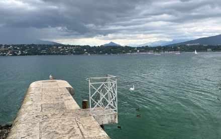 Harbour wall, Lake Geneva, with dark clouds overhead
