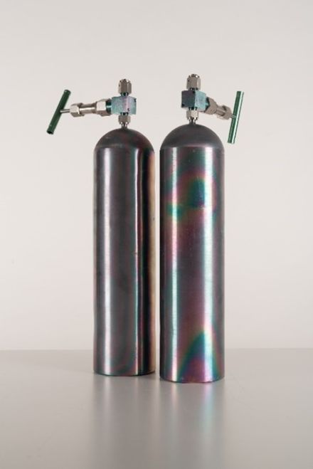 Cylinders filled with primary reference gas mixtures.