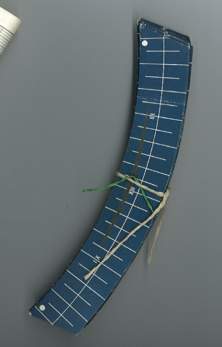 A blue paper strip with a burnt-in line in the centre and a dial indicating the hours in a day is a recording strip of the sun as measurand. They are now archived at the Federal Archive in Bern.