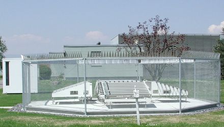 A windprofiler of MeteoSwiss at the Aerosolgical station of Payerne. The fence around the antenna block prevents radar echoes from objects at the ground.