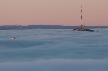 Image of a sea of fog with the occasional protrusion.