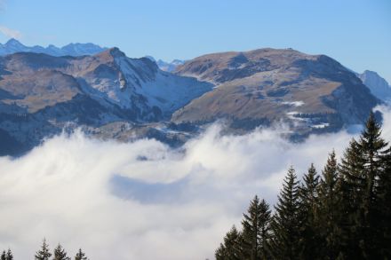 Image showing pronounced waves in the sea of fog in the foreground.