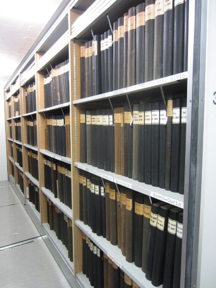 Black books with titles containing the original climate records at MeteoSwiss arranged on a shelf before the transfer to the Federal Archive